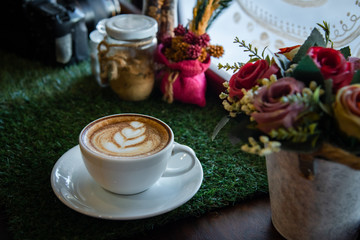 Hot coffee cup on a wooden table.