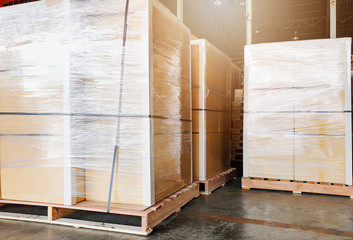 Large shipment goods wrapping plastic on pallets, package boxes, loading freight truck , warehouse industrial service logistics, shipment goods transport