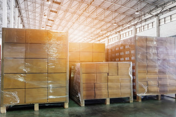 Packaging Boxes Stacked on Pallets in Storage Warehouse. Cartons Cardboard Boxes. Supply Chain. Storehouse Distribution. Shipping Supplies Warehouse Logistics.	