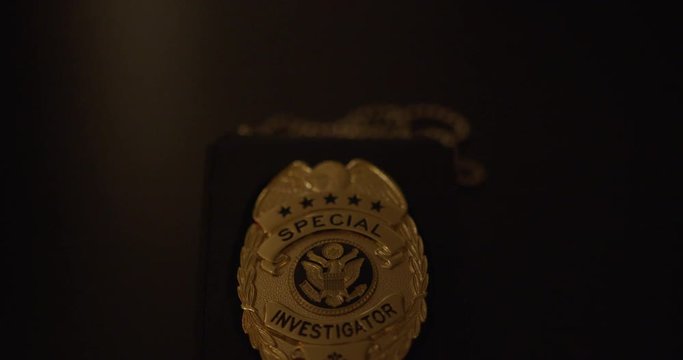 Close Up Tilt of a Special Investigator Shield