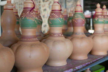 Fototapeta na wymiar Selective focus of Handmade traditional Malay craft known as 'labu sayong'.It is a hand made water storage container. Clay pottery arts.