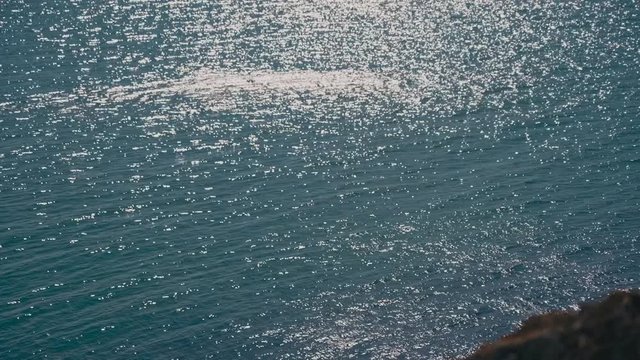 Amazing glare of the sun on the surface of the sea