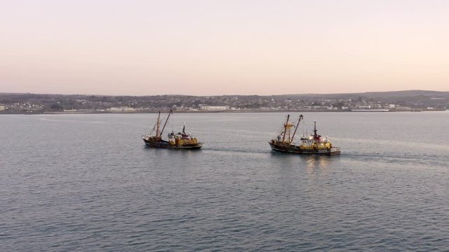 Fishing Trawlers at Sea in the Early Morning Aerial View