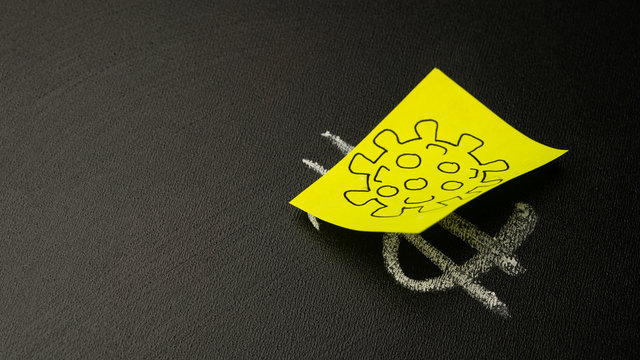 Dollar sign on a blackboard closed with a coronavirus sticker. Concept of an epidemic and pandemic. Danger and fall of the economy. - Powered by Adobe