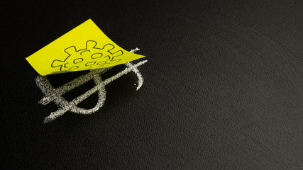 Dollar sign on a blackboard closed with a coronavirus sticker. Concept of an epidemic and pandemic. Danger and fall of the economy.