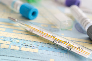 The thermometer is on the sick list- a document about temporary disability. Healthcare in Russia....
