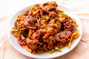 Stir fried with pork and vegetables sprinkle sesame seeds