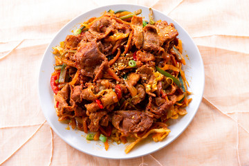 Stir fried with pork and vegetables sprinkle sesame seeds