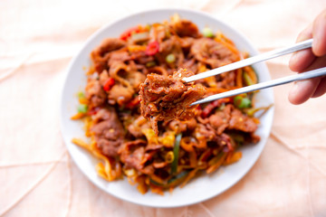 Stir fried with pork and vegetables sprinkle sesame seeds