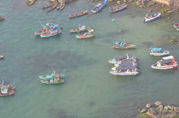 Fototapeta na wymiar Fishing boats top view. Seascape view in Vietnam