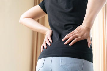 back pain at home. women suffer from backache. healthcare and medical concept