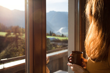 girl looks out the window
