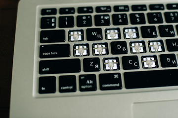 screwdriver and spare parts from a laptop. Keyboard, brush, keys. Laptop repair