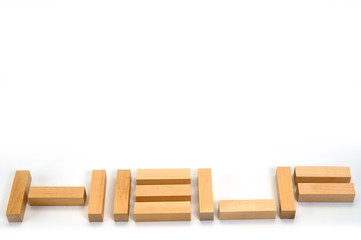 The word Help laid out by wooden blocks on a white background. Background to help those in need.