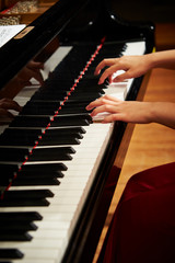 Fototapeta premium A woman playing the piano