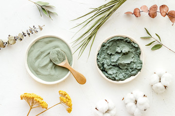 Blue cosmetic clay on white background top-down