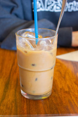 Vietnamese iced coffee with blue straw