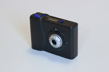 First generation digital compact photographic camera, isolated on white background.