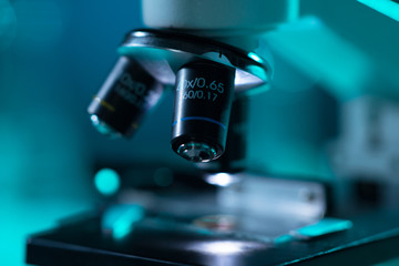 Fototapeta na wymiar Close-up of scientific microscope. Laboratory in hospital. Epidemic disease, healthcare, vaccine research and coronavirus 2019-ncov test.