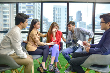 A group of people are working together to discuss mental health problems in the form of mental health, work stress.