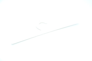 white clothes hanger on a white background