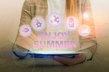 Conceptual hand writing showing Enjoy Summer. Concept meaning taking a break from school and...