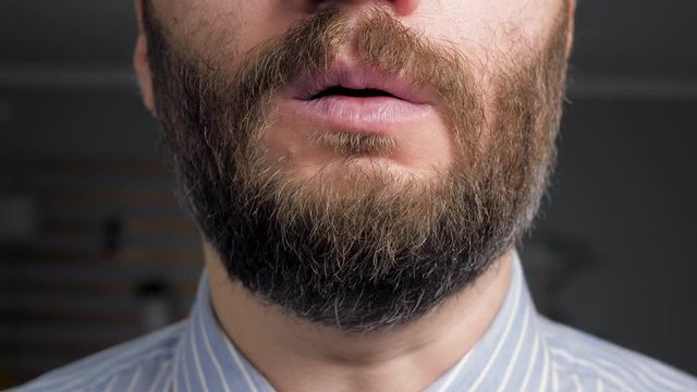 Man coughs and covers her mouth with napkin. Colds, flu, laryngitis, tuberculosis, asthma, bronchitis, allergies, pneumonia, APF inhibitors, nasopharyngeal leakage concepts. Front view. Close-up