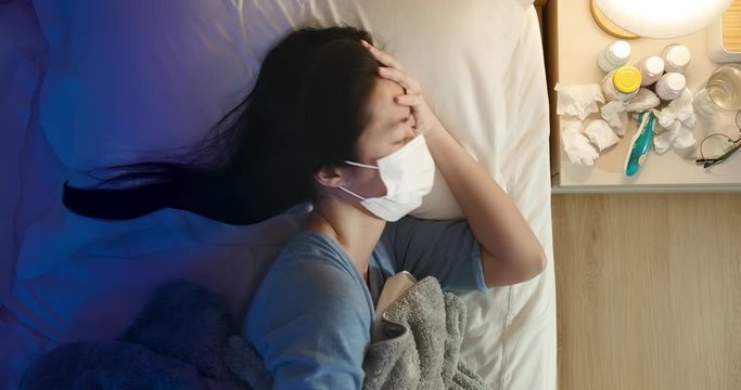 woman sick and has fever