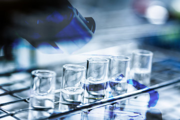 Double exposue microscope with test tube.