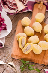Fototapeta na wymiar Potato gnocchi stuffed with radicchio and ricotta.