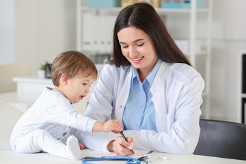 Fototapeta premium Pediatrician examining little baby in clinic