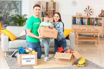 Volunteers with donations and little girl at orphan home