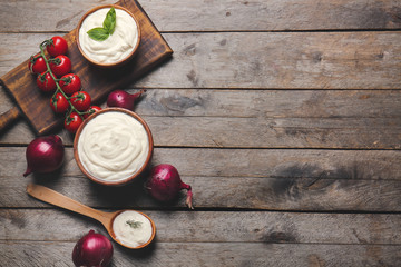 Composition with tasty sour cream on table