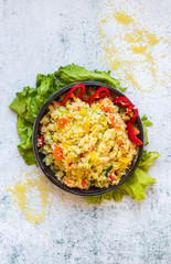 Cooked couscous crushed durum wheat semolina millet with vegetables. Vegan, vegetarian low fat healthy food