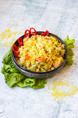 Cooked couscous crushed durum wheat semolina millet with vegetables. Vegan, vegetarian low fat healthy food