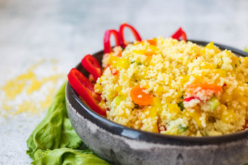 Cooked couscous crushed durum wheat semolina millet with vegetables. Vegan, vegetarian low fat healthy food