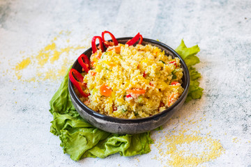 Cooked couscous crushed durum wheat semolina millet with vegetables. Vegan, vegetarian low fat healthy food