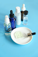 hand sanitizer. bottle of homemade disinfecting gel and ingredients (aloe vera, aroma oil, glycerin, alcohol). prevention through antibacterial hygiene. zero waste diy. 