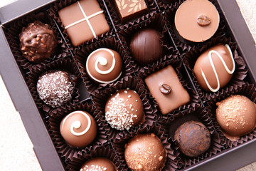 Box with delicious candies, closeup