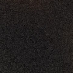 Black sand texture. Asphalt closeup background. Abstract simple pattern of material surface.