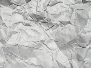 Obraz premium Top view of white crumpled paper texture background. Copy space for design and artwork
