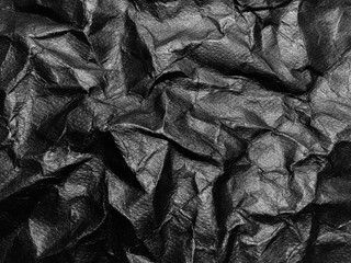 Black crumpled paper texture background. Copy space for design and artwork