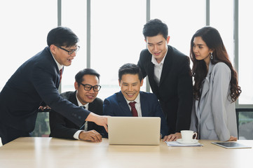 Asian business people team analyzing statistics financial. Team of businesspeople Meeting Conference Discussion Corporate Concept in office.