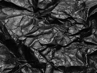 Black crumpled paper texture background. Copy space for design and artwork