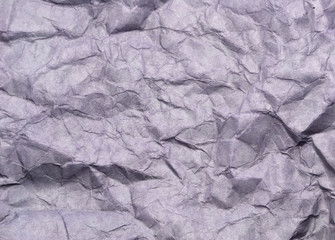 Abstract modern purple crumpled paper texture background.