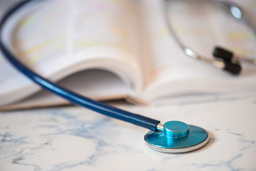 Stethoscope on the pages of a text book