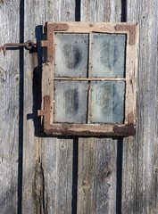 Old window frame with dirty glass