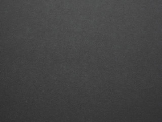 Empty black paper background texture, Concept for image, text, design. Soft backdrop blurred.