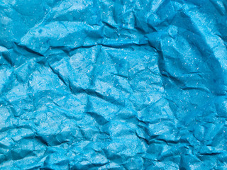 Texture of blue crumpled paper background for design