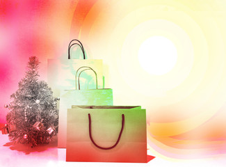 The brown color paper shopping bags and the silver color Chrismas tree on colorful background with copy space